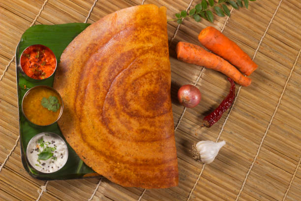 Paper Dosa with sambar and coconut chutney. South Indian Vegetarian Snack Paper Dosa with sambar and coconut chutney. South Indian Vegetarian Snack thosai stock pictures, royalty-free photos & images