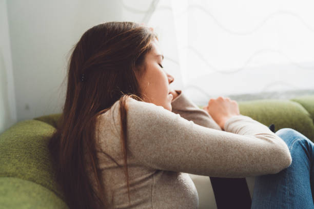 istock Sick caucasian woman resting on the couch 1205482706