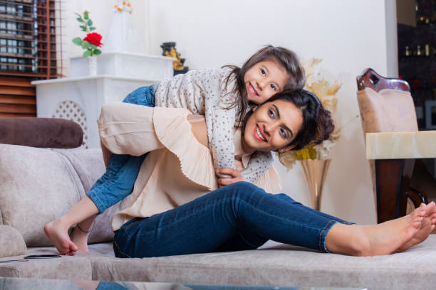 Mother and daughter having fun stock photo Parent, People, girls, mother, daughter, Embracing, Child, indian ethnicity lifestyle stock pictures, royalty-free photos & images