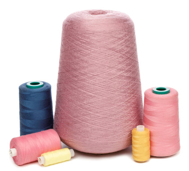 istock Cones and spools of color threads on white background 1205484152