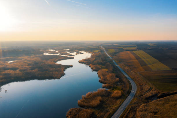 istock Aerial view over lake,agricultural fields and highway 1205485174