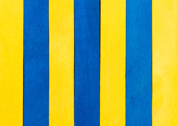 istock yellow with blue colour wood texture background 1205486848