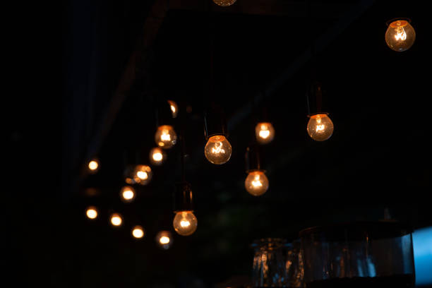 Many pendant burning lights for interior decoration shine in the dark.