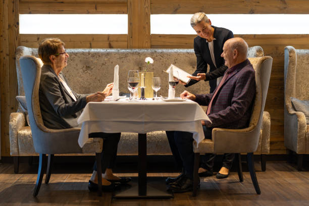 senior couple eating out in luxury restaurant