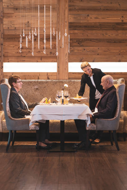 istock senior couple at table for two in alpine mountain luxury restaurant 1205488258