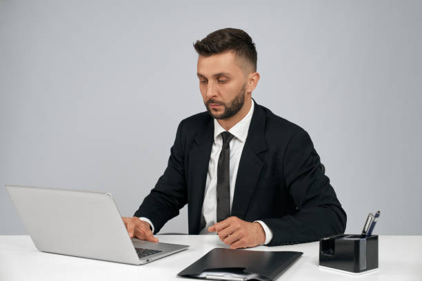 istock Young businessman working on laptop. 1205489618