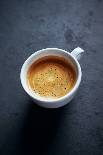 istock Cup of coffee on black background. Copy space. 1205489832