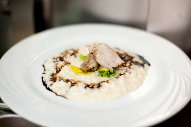 plate of risotto stock photo