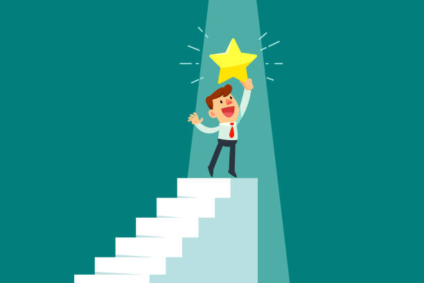 istock businessman holding gold star on top of staircase 1205490524