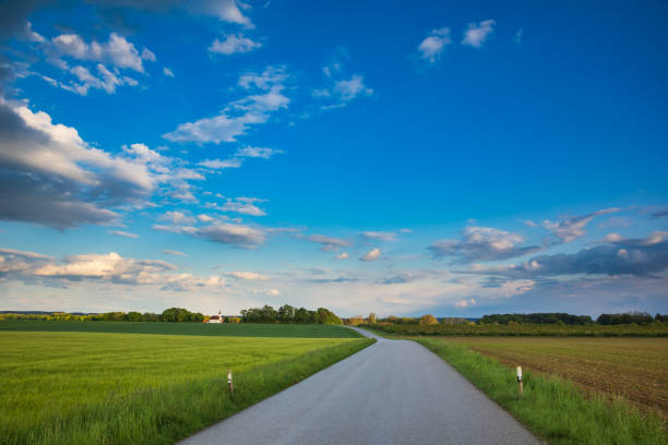 istock Country road thru rural Bavaria in Germany 1205492163