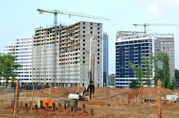istock Piles driven into the ground by hydraulic hammer 1205492310