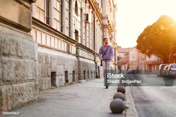 Businessman On The Wheels Stock Photo - Download Image Now - Electric Push Scooter, Push Scooter, Mobility Scooter