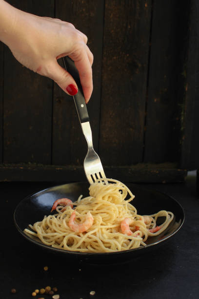 istock pasta prawn (spaghetti shrimp cream sauce and seafood ) menu concept. food background. top view. copy space 1205494472