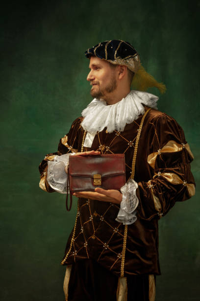 istock Medieval young man in old-fashioned costume 1205496166