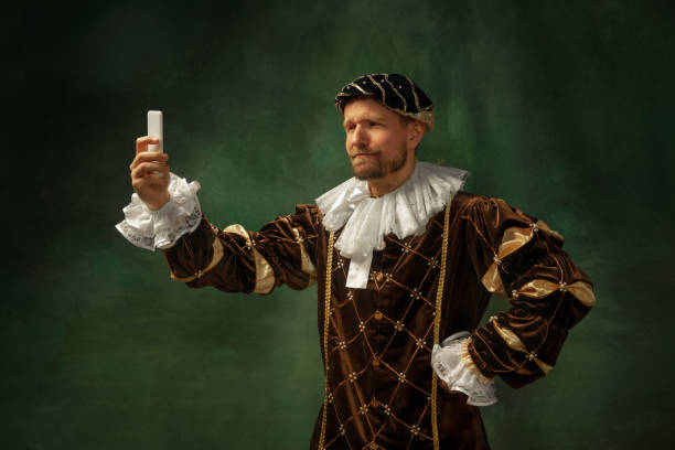 istock Medieval young man in old-fashioned costume 1205496176