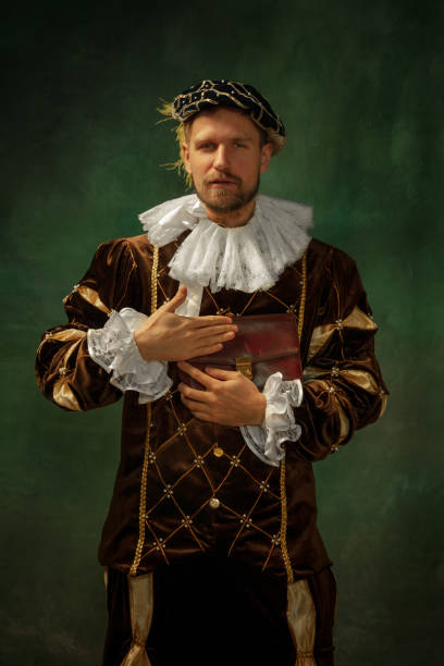 istock Medieval young man in old-fashioned costume 1205496190