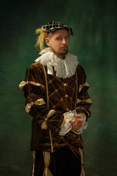 istock Medieval young man in old-fashioned costume 1205496218