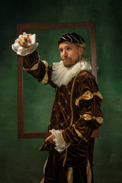 istock Medieval young man in old-fashioned costume 1205496231