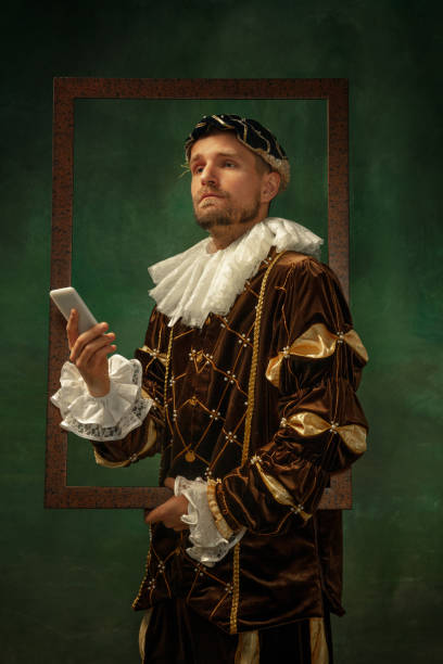 istock Medieval young man in old-fashioned costume 1205496240