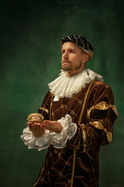 istock Medieval young man in old-fashioned costume 1205496276