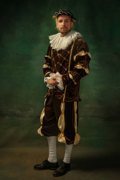 istock Medieval young man in old-fashioned costume 1205496283