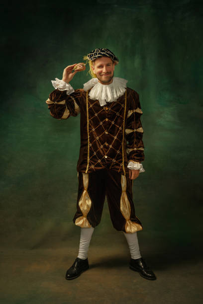 istock Medieval young man in old-fashioned costume 1205496302