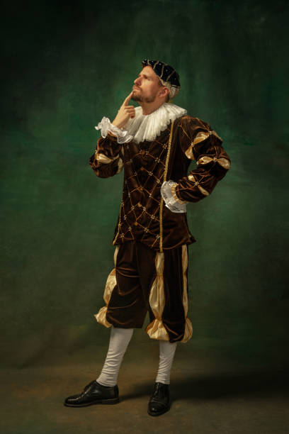 istock Medieval young man in old-fashioned costume 1205496352