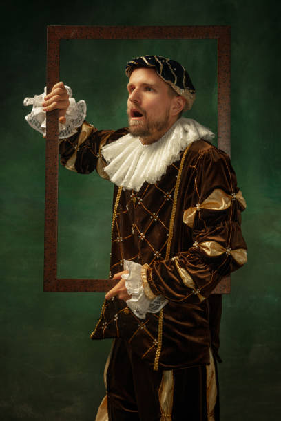 istock Medieval young man in old-fashioned costume 1205496375