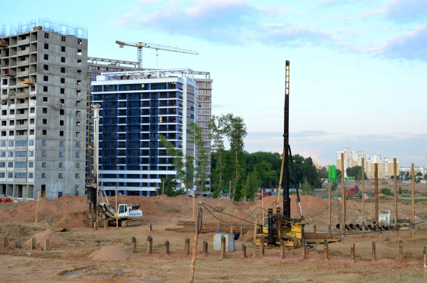 istock Piles driven into the ground by hydraulic hammer 1205499467