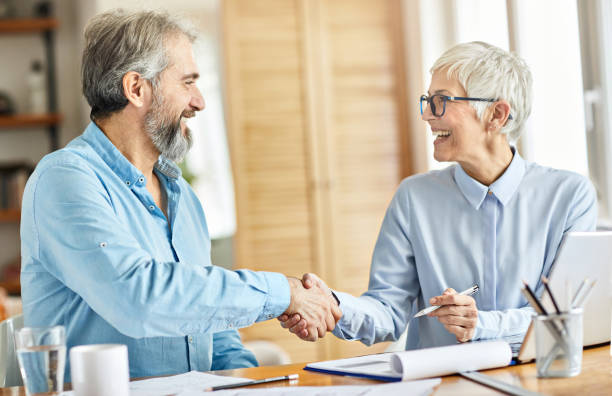 istock business man woman office work hand shaking meeting agreement 1205499557