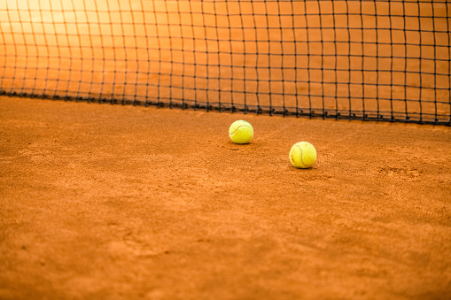 Tennis balls in tennis court