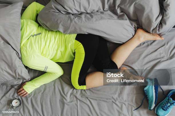 The Concept The Woman Is Too Lazy To Wake Up In The Morning For Training Stock Photo - Download Image Now