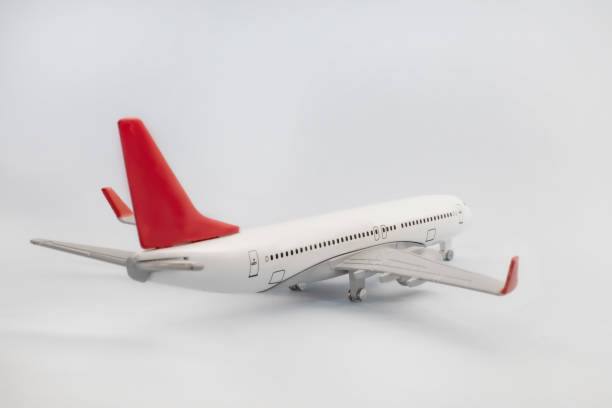 istock model metal passenger airplane / back view / isolated background 1205502919