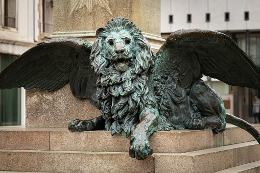 Closeup of a statue of a lion made of bronze in Venice