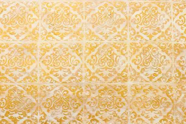 Photo of background of royal gold wooden vintage background with floral emboss details