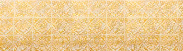 Photo of background of royal gold wooden vintage background with floral emboss details