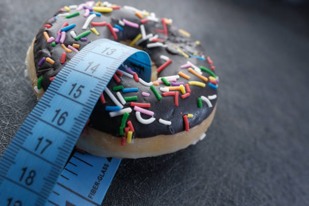 istock measurement tape and donut 1205507859