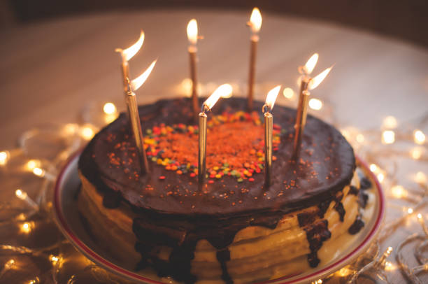 istock Home made cake with candles and decorated with red heart. 1205507936