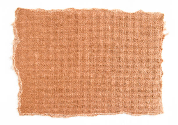 istock Torn piece of brown cardboard paper with rough surface isolated on white background. Can be used for text message. 1205509348