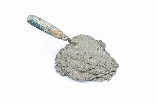 Cement or mortar, Cement mix with a trowel put isolated on white background for construction work.