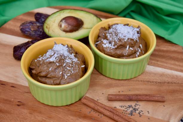 istock Vegan avocado chocolate mousse with coconut flakes 1205513681