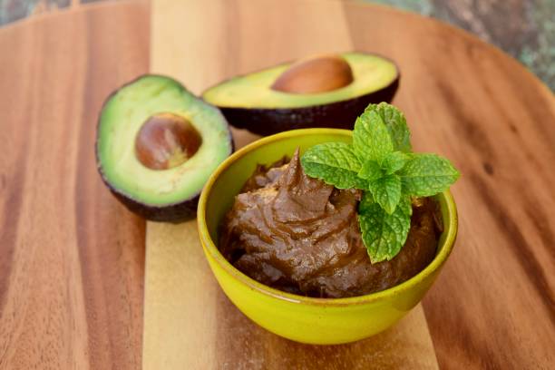 istock Vegan avocado chocolate mousse garnish with mint leaf 1205513785