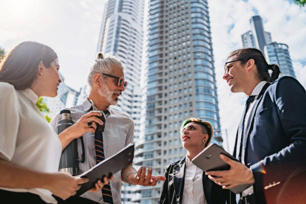 istock Business people discussing outdoors 1205514118