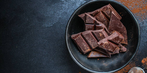 istock chocolate (delicious cocoa dessert, pieces of sweets) menu concept. food  background top view. copy space 1205515383