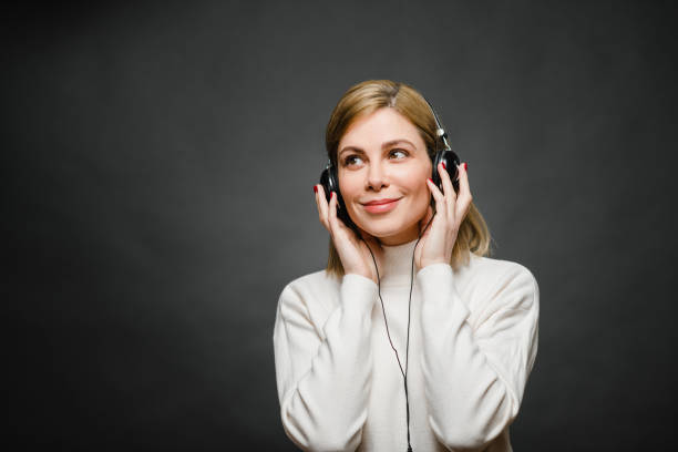 istock Young Woman with headphones 1205517342