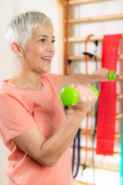 istock Senior Woman Exercising With Dumbbells 1205526522