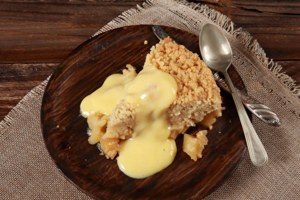 istock Freshly baked Apple Crumble Pie with Custard 1205527112