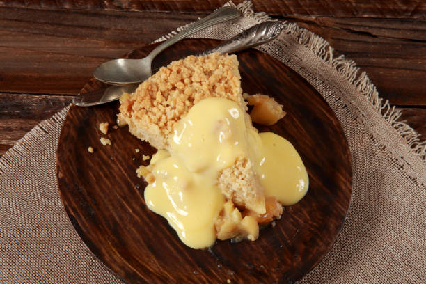 istock Freshly baked Apple Crumble Pie with Custard 1205527137