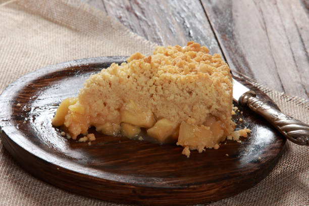 istock Freshly baked Apple Crumble Pie with Custard 1205527145