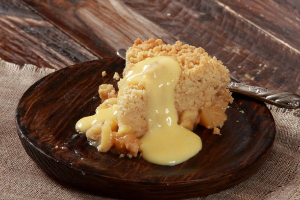 istock Freshly baked Apple Crumble Pie with Custard 1205527148